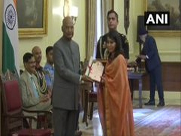 President Ram Nath Kovind confers award on an artist in New Delhi on Wednesday. Photo/ANI