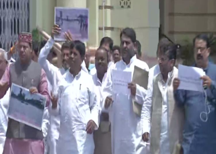 Opposition leaders protested in front of Legislative Assembly over flood situation in Bihar onTuesday. Photo/ANI