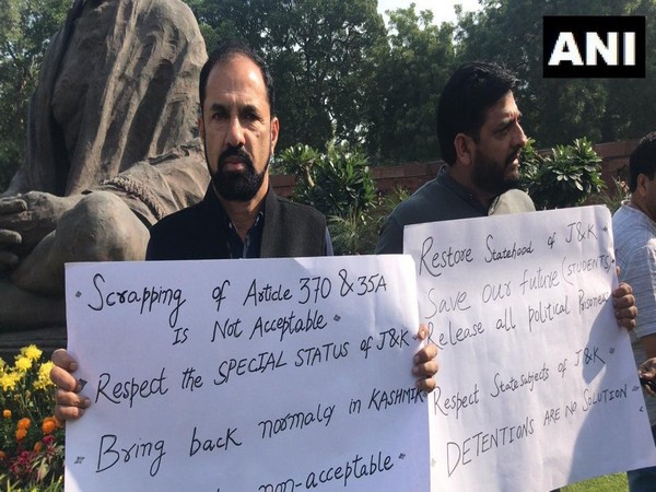 Rajya Sabha MPs Nazir Ahmad Laway and Mir Mohammed Fayaz staging protest outside Parliament on Monday. (Photo/ANI)