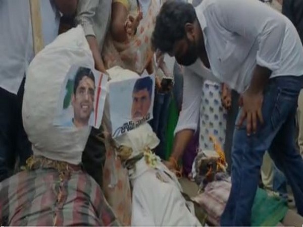 Ruling YSRCP protest against Opposition TDP for creating hurdles in house site pattas scheme in Andhra Pradesh on Wednesday. Photo/ANI