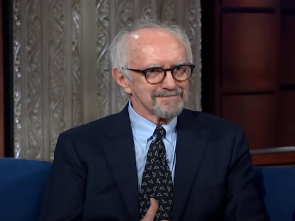 A still from a late night talk show featuring actor Jonathan Pryce (Image source: YouTube) 