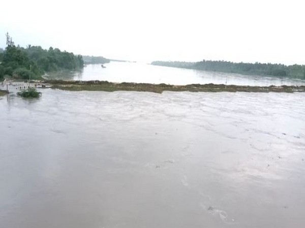 Puligadda bridge submerged under floodwaters due to heavy rains. Photo/ANI