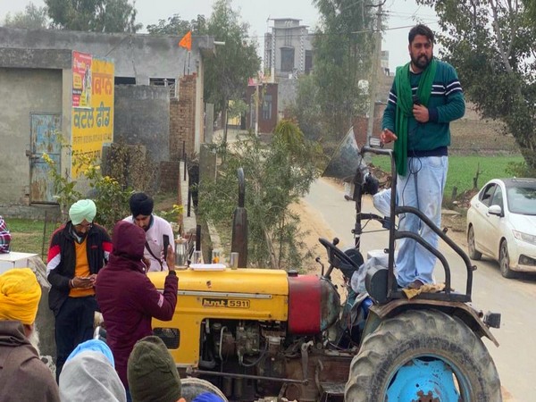 Gurpreet Kotli campaiging for the election on his tractor in the Daula village of Giddarbaha. (ANI/photo)