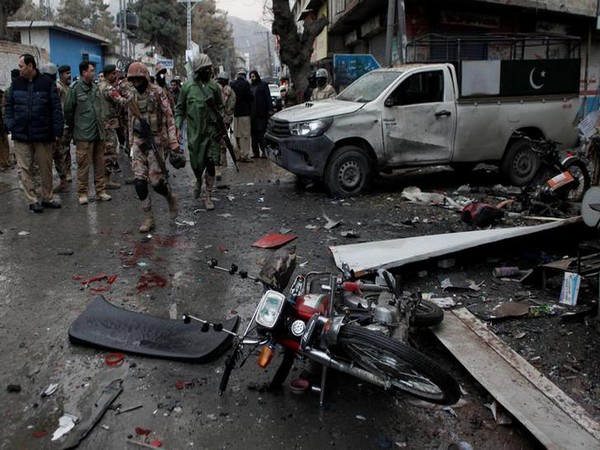 Paramilitary soldiers gather at the site after a bomb blast in Quetta