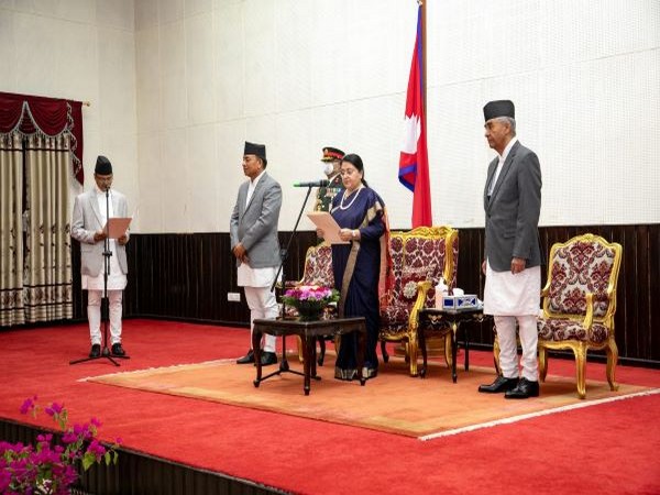 President Bidya Devi Bhandari administering oath to new Minister of Law Govinda Bandi (Photo/ANI)