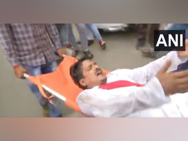 RJD MLA Satish Kumar was carried on a stretcher from Bihar Assembly. (Photo/ANI)