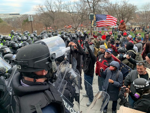 Protesters clashing with police officers outside US Capitol in Washington.