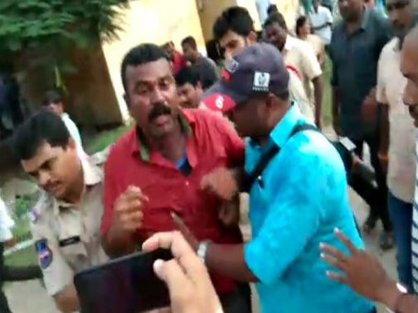 RTC Employee Bathini Ravi escorted by the police in Warangal on Sunday. Photo/ANI