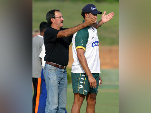 Former Australia spinner Bruce Yardley passing on instructions to Andrew Symonds