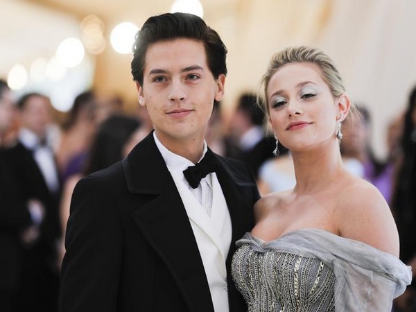 Cole Sprouse and Lili Reinhart posing at Met Gala 2018.