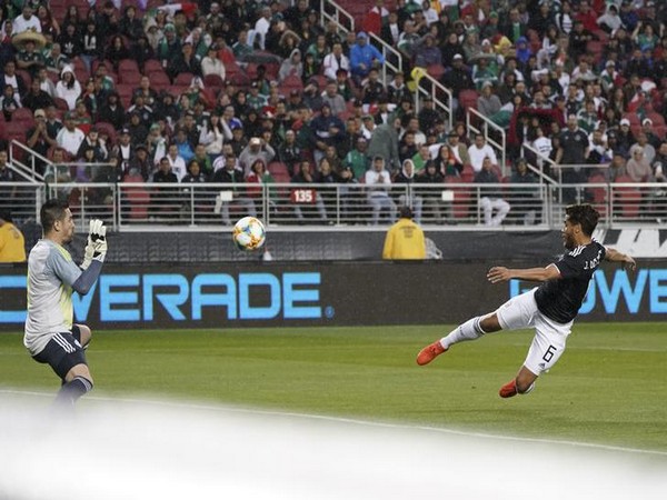 Mexican footballer Jonathon dos Santos scores a goal against Paraguay
