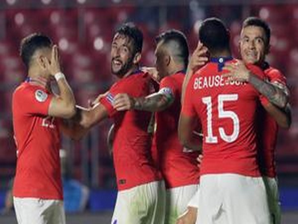 Chile players celebrate after scoring a goal