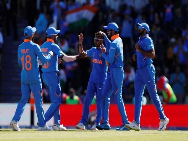 India's Yuzvendra Chahal celebrates with team mates after taking the wicket of Afghanistan's Rahmat Shah