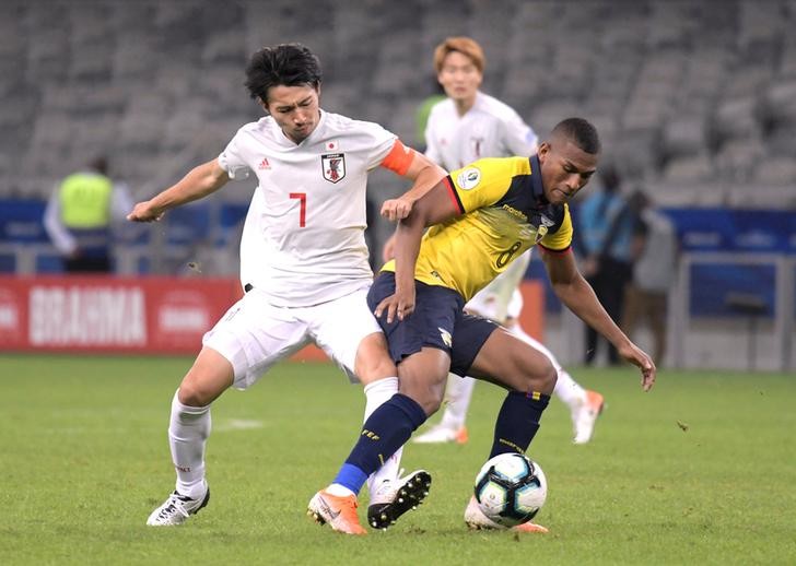 Players in action in match between Japan and Ecuador