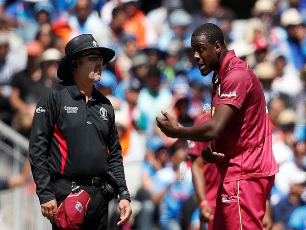West Indies player Carlos Brathwaite with umpire on Thursday. 