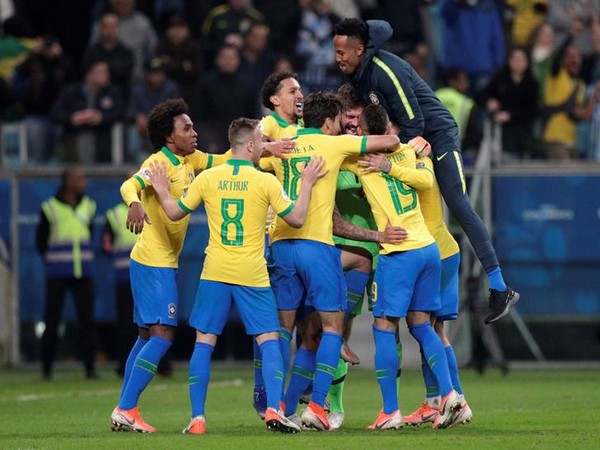 Brazil players celebrating after winning against Paraguay by 4-3 in penalty shoot-out