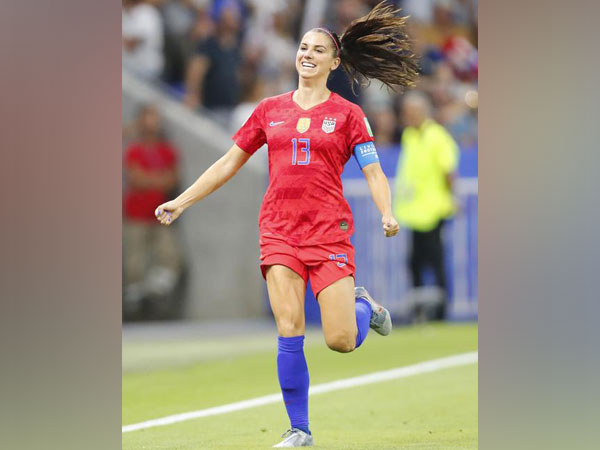 United States forward Alex Morgan celebrates after scoring a goal against England in the first half of semi-final play in the FIFA Women's World Cup