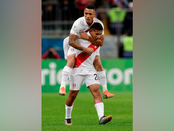 Peru's Edison Flores celebrates scoring their first goal against Chile