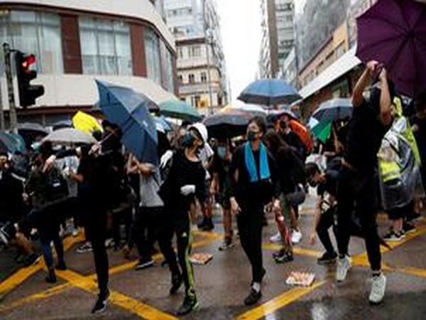 Protesters carrying umbrellas while marching in Hung Hom as part of the months-long anti-government protests in Hong Kong on Saturday.