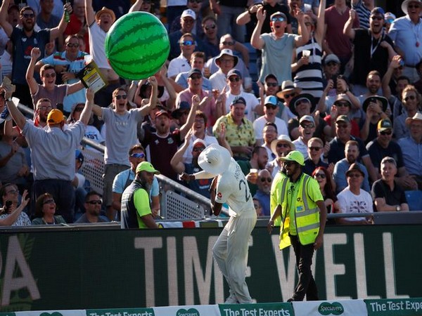 England's Jofra Archer throws an inflatable watermelon towards fans during the match