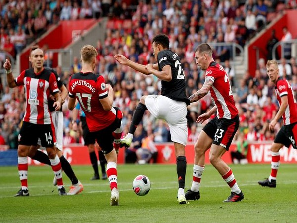 Southampton's Stuart Armstrong and Pierre-Emile Hojbjerg in action with Manchester United's Mason Greenwood
