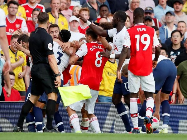 Tottenham Hotspur's Danny Rose clashes with Arsenal's Sokratis Papastathopoulos
