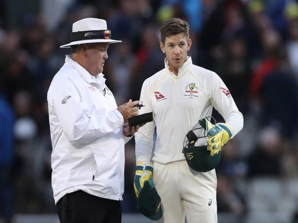 Australia skipper Tim Paine with umpire Marais Erasmus 