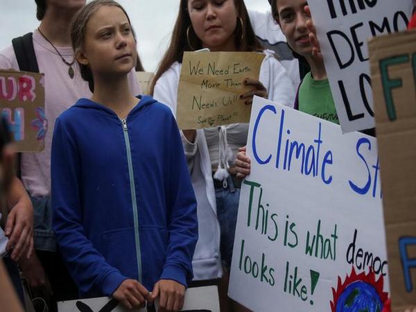 Greta Thunberg, Swedish activist for climate change (in the blue sweatshirt)