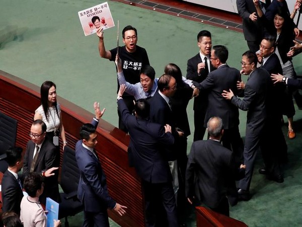 Carrie Lam leaves after her annual policy address was cancelled due to protests by pro-democracy lawmakers at the Legislative Council in Hong Kong on Wednesday. Photo/ANI
