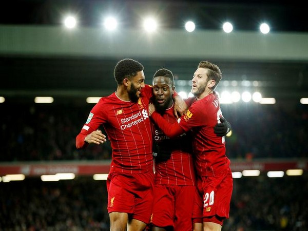 Divock Origi celebrates scoring their fifth goal with teammates Joe Gomez and Adam Lallana
