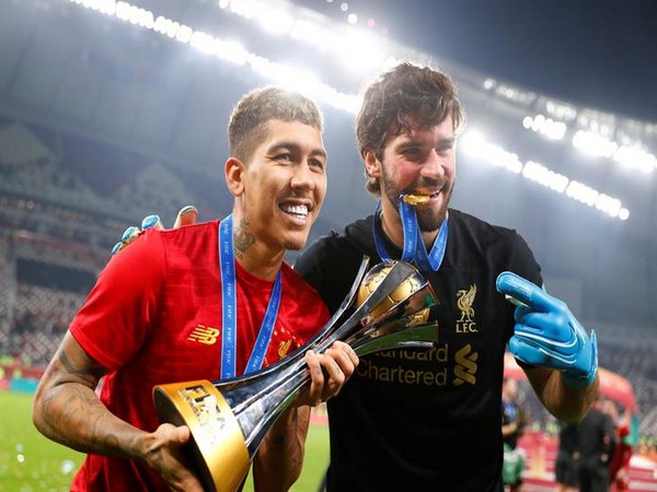 Liverpool's Roberto Firmino and Alisson Becker 