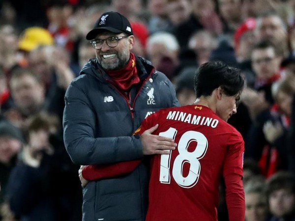 Liverpool manager Jurgen Klopp with Takumi Minamino