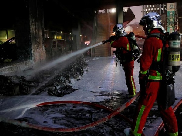 Fire fighters work at the scene of a fire near Gare de Lyon railway station in Paris