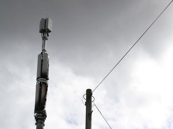 A telecommunications mast damaged by fire in Sparkhill, Birmingham. Masts have in recent days been vandalised amid conspiracy theories linking COVID-19 and 5G towers