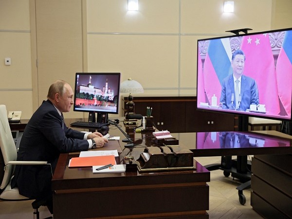 Russian President Vladimir Putin holds talks with Chinese President Xi Jinping via a video link at his residence outside Moscow, Russia December 15, 2021. (Photo Credit: Reuters)