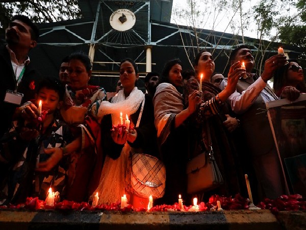 People light candles, in commemoration of the victims of an attack on the Army Public School (APS) in 2014, in Karachi, Pakistan December 16. (Photo Credit: Reuters)