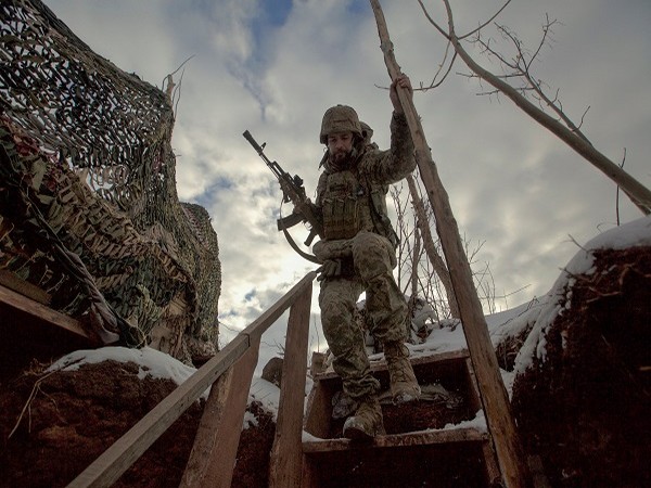 A service member of the Ukrainian armed forces walks at combat positions near Horlivka in the Donetsk region, Ukraine. (Photo Credit: Reuters)