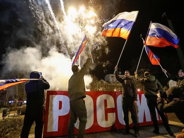 Pro-Russian activists after Russian President Vladimir Putin signed a decree recognising two Russian-backed breakaway regions in eastern Ukraine as independent entities (Photo Credit: Reuters)
