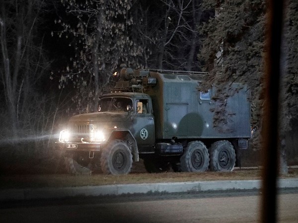 A military vehicle is seen on a street on the outskirts of Donetsk, Ukraine February 23, 2022. (Photo Credit: REUTERS)
