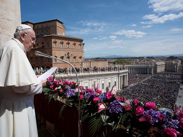 Pope Francis delivers message from the balcony overlooking St. Peter's Square on Easter Sunday (Photo Credit - Reuters)