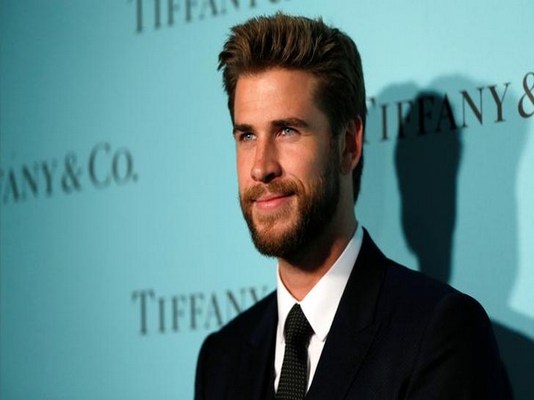 Liam Hemsworth poses at a reception for the re-opening of the Tiffany & Co. store in Beverly Hills