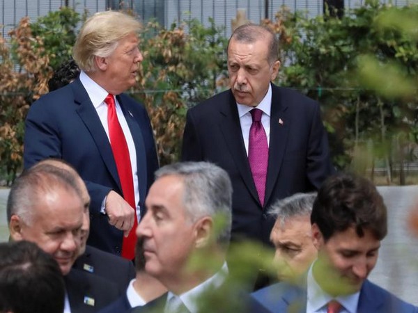 U.S. President Donald Trump, Turkish President Tayyip Erdogan and Canada's Prime Minister Justin Trudeau are seen at the start of the NATO summit in Brussels, Belgium