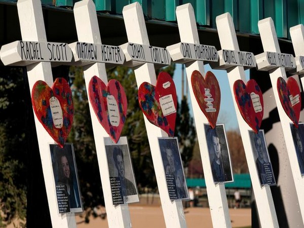 A line of crosses commemorating some of those killed are displayed near the Columbine memorial a day before the school shootings’ 20th anniversary in Littleton, Colorado