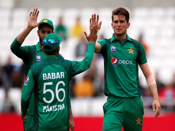 Pakistan's Shaheen Shah Afridi celebrates with Babar Azam after taking a wicket