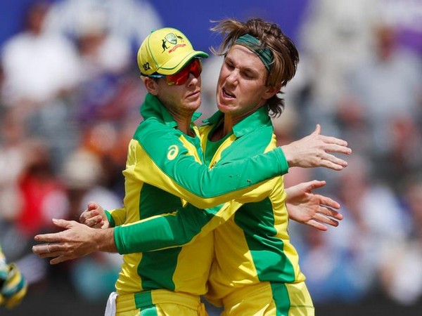 Adam Zampa celebrates with Steve Smith after taking a wicket against Afghanistan