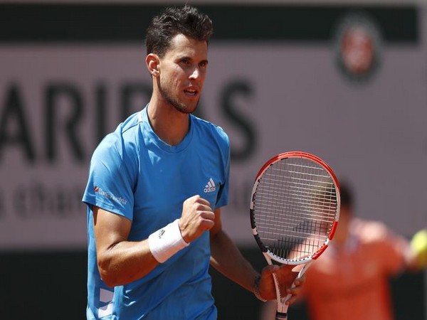 Tennis player Dominic Thiem in action against Novak Djokovic