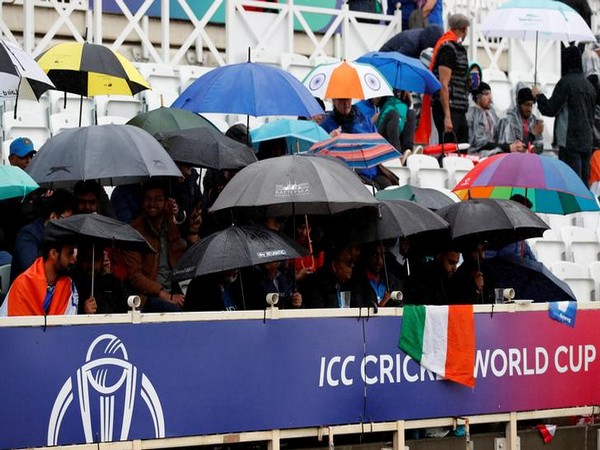 Fans with umbrella at the Trent Bridge stadium on Thursday.