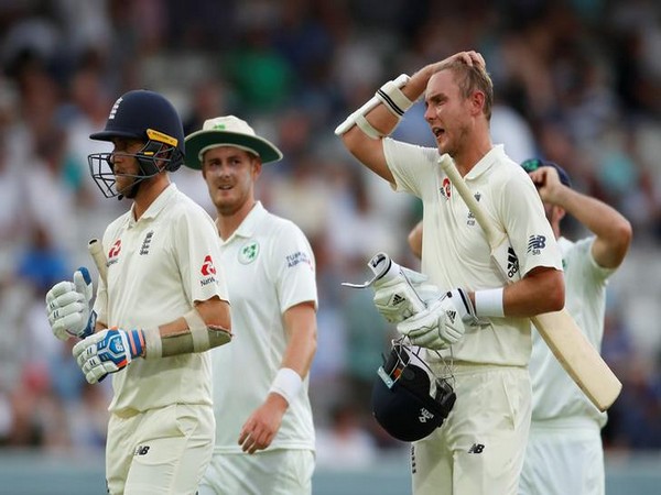 England's Stuart Broad and Olly Stone react as they walk off after the umpires suspended play due to bad light