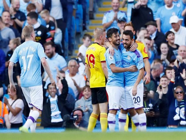 Manchester City's Bernando Silva celebrates with David Silva after scoring a goal against Watford
