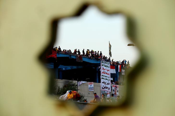 Iraqi demonstrators take part in the ongoing anti-government protests in Baghdad, Iraq November 3,